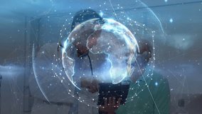 Senior doctor and staff placing tablet, holo globe over tablet rotating with data for health review. Collaboration, teamwork, medical, healthcare, augmented, reality, holographic - Powered by Shutterstock - Get 15% off with code: PIKWIZARD15