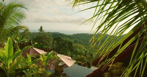 Woman slow walking toward infinity pool symbolizing balance and wellness travel, she spreads arms on tropical villa terrace - Powered by Shutterstock - Get 15% off with code: PIKWIZARD15