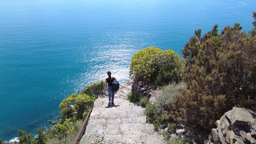 Italy, Liguria, La Spezia - Monesteroli in the Cinque Terre National Park is a small, almost uninhabited village famous for its 2,200-step staircase overlooking the sea - tourist trekking  tourists go trekking and walking