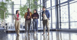 Diverse coworkers entering office atrium holding coffee cup, bumping fists, shaking hands to greet. Collaboration, professional, modern, architecture, networking, teamwork, casual - Powered by Shutterstock - Get 15% off with code: PIKWIZARD15