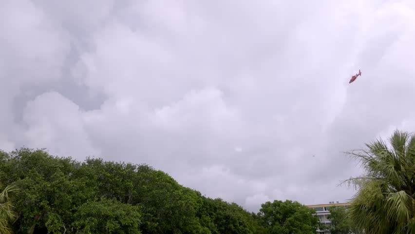 Helicopter flying over Charleston, South Carolina with stable drone video.