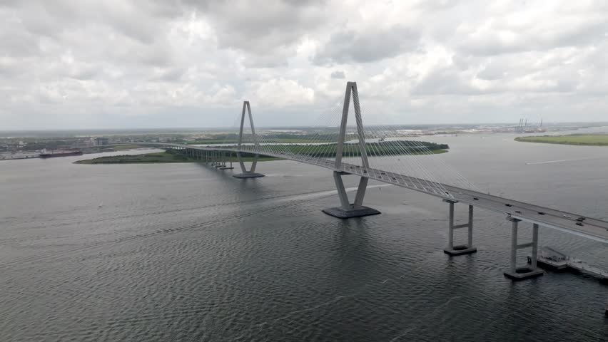 Ravenel Bridge in Charleston, South Carolina with traffic and stable drone video.