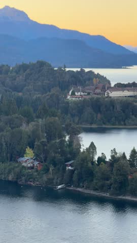 sunset in Nahuel Huapi National Park with views of the lake, mountains and the iconic Llao Llao hotel. Bariloche, Patagónia, Argentina. 