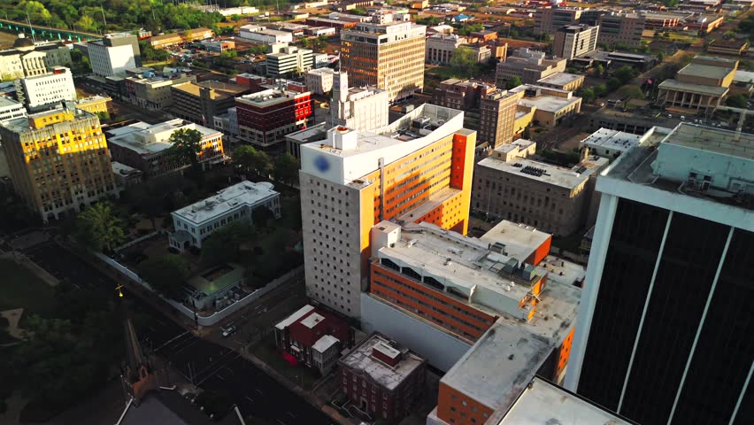 Drone view downtown streets buildings evening light Jackson Mississippi USA