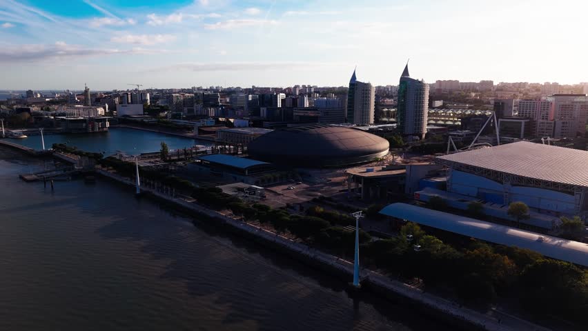 Aerial view of Altice Arena and Vasco da Gama Tower in Parque das Nacoes on a cloudy day. Lisbon, Portugal