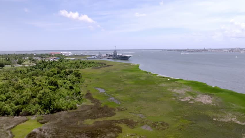 USS Yorktown in dry dock in Charleston Harbor in South Carolina with drone video moving in.