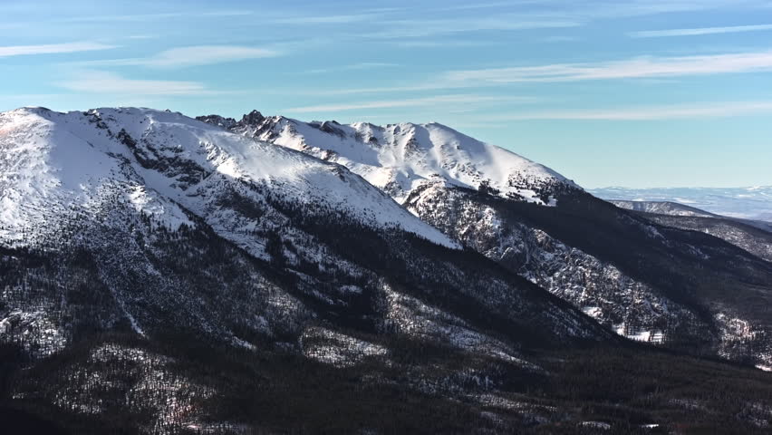 70mm-style aerial drone shot of snowy peaks surrounding Dillon and Frisco near Breckenridge in Colorado