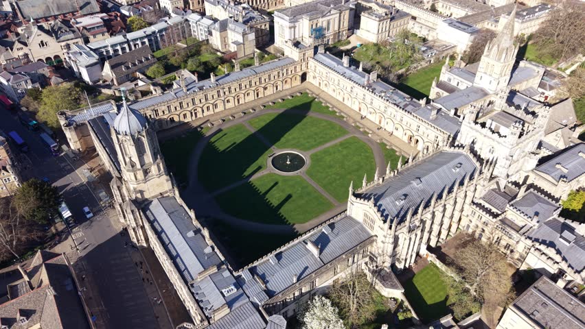 4K drone footage showing Oxford colleges and central city buildings in bright daylight.