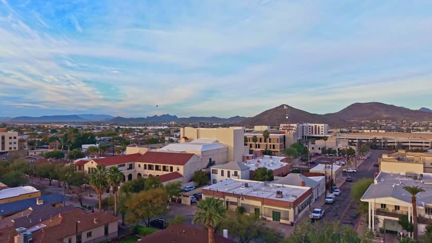 Aerial perspective shows Tucson cityscape under morning light with surrounding desert landscape in Arizona
