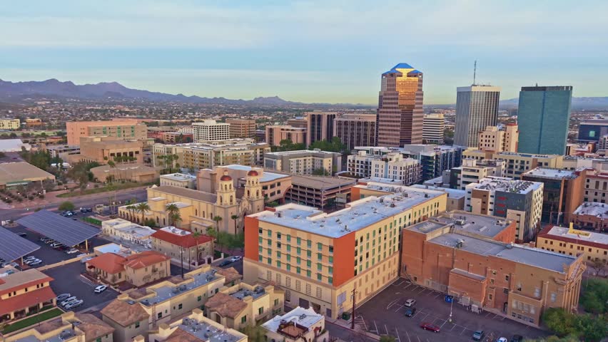 Aerial perspective shows Tucson cityscape under morning light with surrounding desert landscape in Arizona
