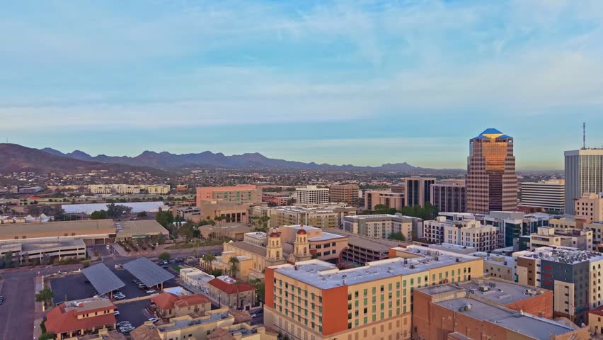 Aerial perspective shows Tucson cityscape under morning light with surrounding desert landscape in Arizona