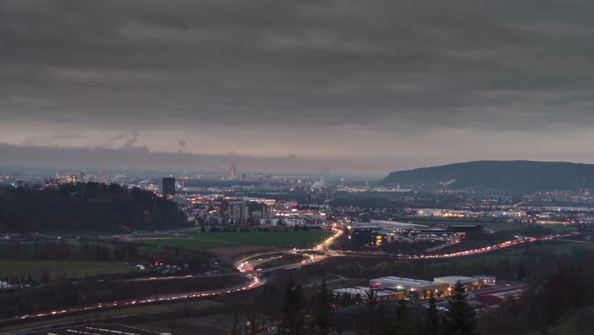 Long Exposure Night Time-lapse of City Highway Traffic Lights and Urban Skyline