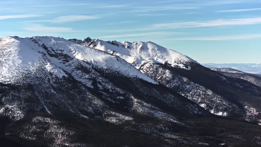 70mm-style aerial drone shot of snowy peaks surrounding Dillon and Frisco near Breckenridge in Colorado