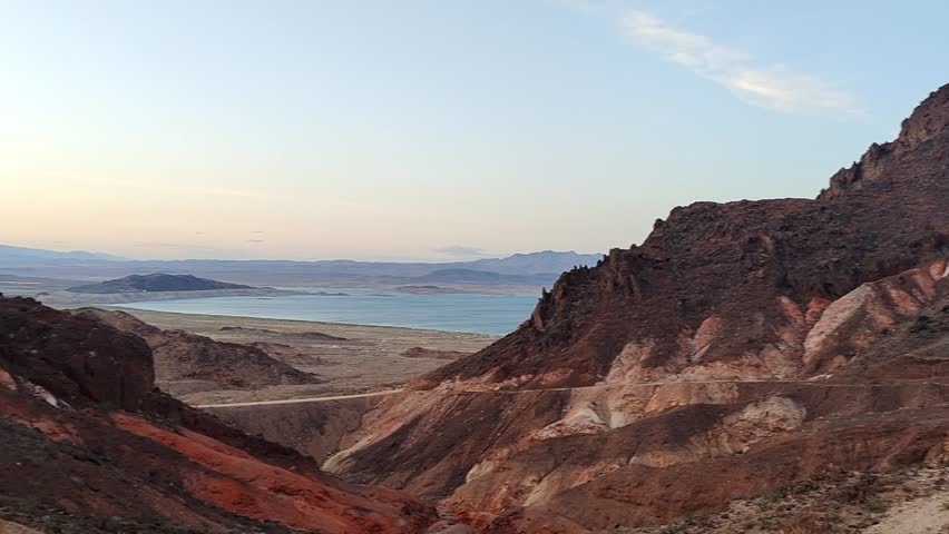 Scenic panoramic view of the Grand Canyon West Rim in Arizona, USA. Desert landscape with layered red rock cliffs, deep canyon formations, Colorado River view. A road trip near Eagle and Guano Point