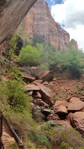 Scenic panoramic view of the Grand Canyon West Rim in Arizona, USA. Desert landscape with layered red rock cliffs, deep canyon formations, Colorado River view. A road trip near Eagle and Guano Point