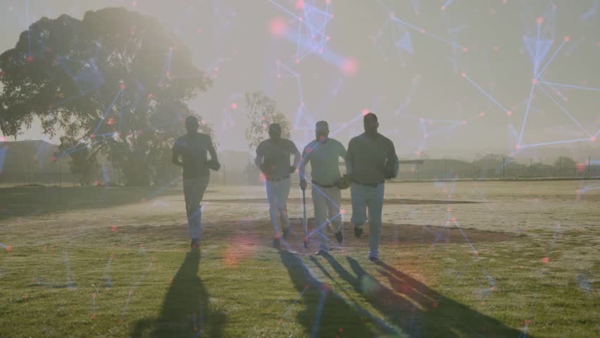 Five players walking across sports field, star net linking them, leader tapping bat starting drill. Baseball, teamwork, outdoor, ballpark, gloves, backlighting, lensflare