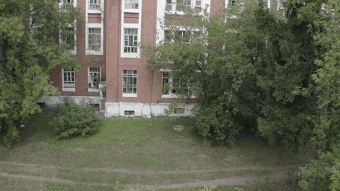 Aerial Upward Movement along Old Building Facade
