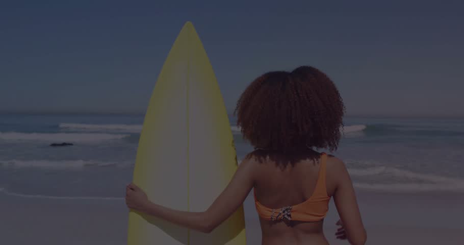 Woman holding surfboard shading eyes scanning surf waves as sun starting overlays over her receding. Beach, ocean, horizon, surfer, board, bikini, sunny