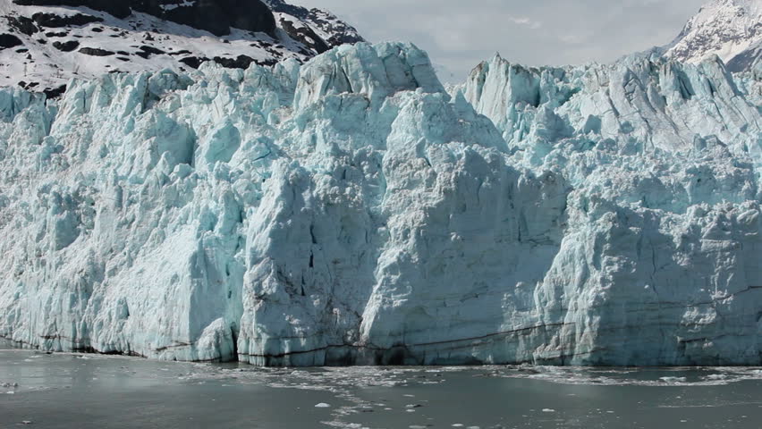 Margerie Glacier tidewater calving Glacier Bay part 1. Glacier is a 21 mile long and a mile wide tide water glacier in Glacier Bay National Park, Alaska.  Large cruise ships park close to the glacier Royalty-Free Stock Footage #4054486