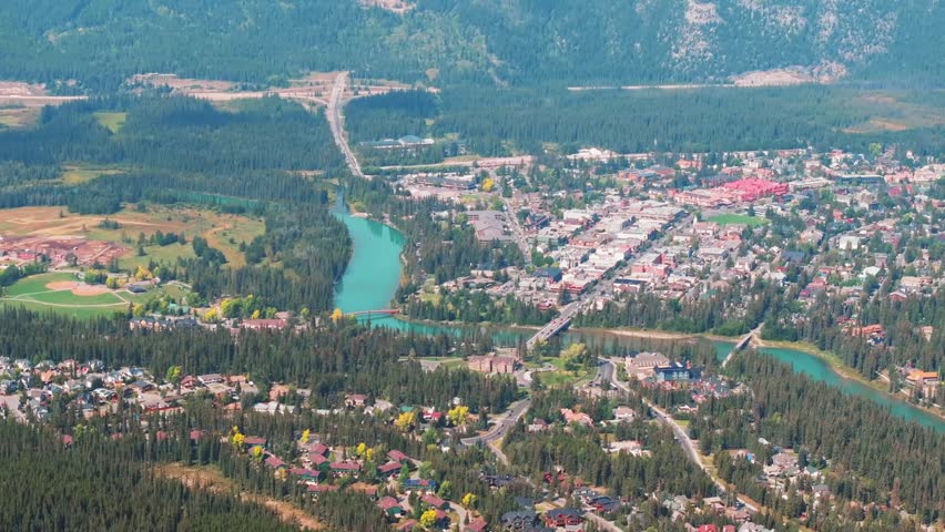 Aerial Revealing shot, Town of Banff, Morning shot. Banff National Park, Alberta, Canada.