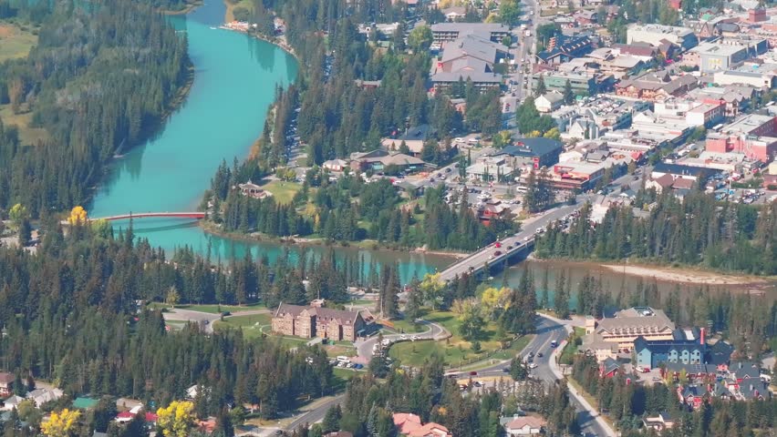 Aerial Revealing shot, Town of Banff, Morning shot. Banff National Park, Alberta, Canada.