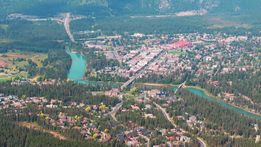 Aerial Revealing shot, Town of Banff, Morning shot. Banff National Park, Alberta, Canada.