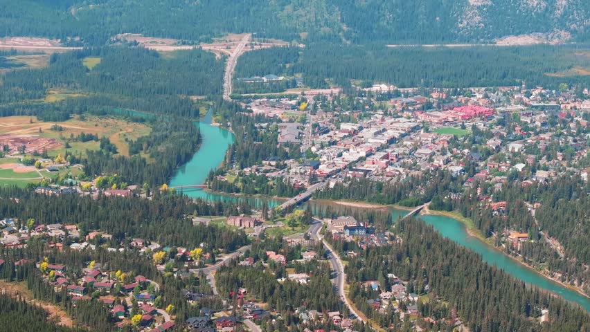 Aerial Revealing shot, Town of Banff, Morning shot. Banff National Park, Alberta, Canada.