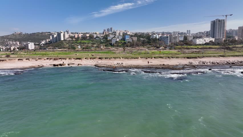 Panoramic Aerial View of Haifa City Skyline and Coastal Promenade Along the Turquoise Mediterranean Sea Shoreline