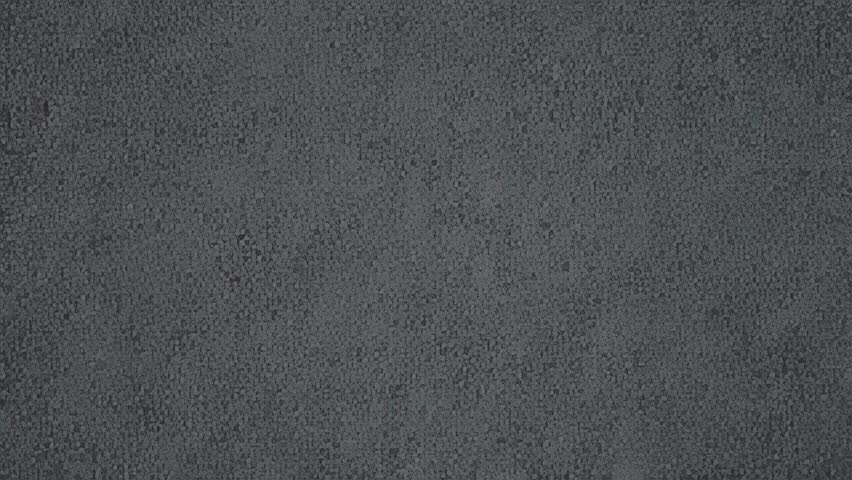 Detailed close-up of a dark gray textured surface. The granular pattern suggests carpet or fabric offering a neutral and abstract background