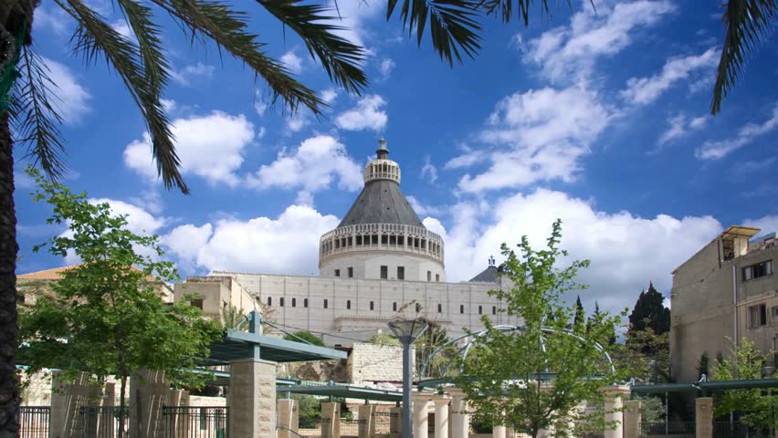 NAZARETH, ISRAEL The Basilica of the Annunciation is a modern Christian church, which was erected on the site where the Annunciation of the Most Holy Theotokos took place.Aerial footage of the Basilica of the Annunciation over the old city houses of Nazareth