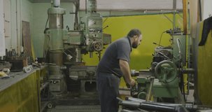 Machinist turning wheel and adjusting lathe in shop, animating charts into world map for monitoring. Metalworker, workshop, machinery, data, overlay, graphs, analytics - Powered by Shutterstock - Get 15% off with code: PIKWIZARD15