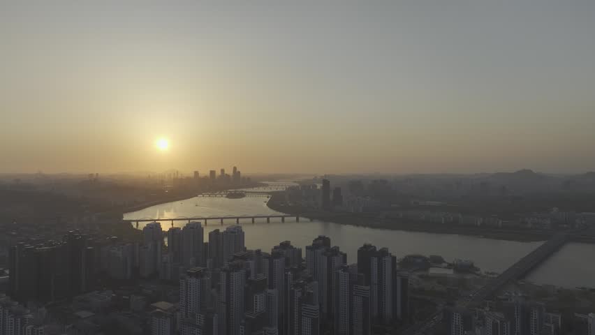 Aerial view of a stunning sunset over the Han River from Banpo, Seoul, with Some Sevit and Moonlight Rainbow Fountain, South Korea.