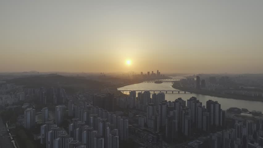 Aerial view of a stunning sunset over the Han River from Banpo, Seoul, with Some Sevit and Moonlight Rainbow Fountain, South Korea.