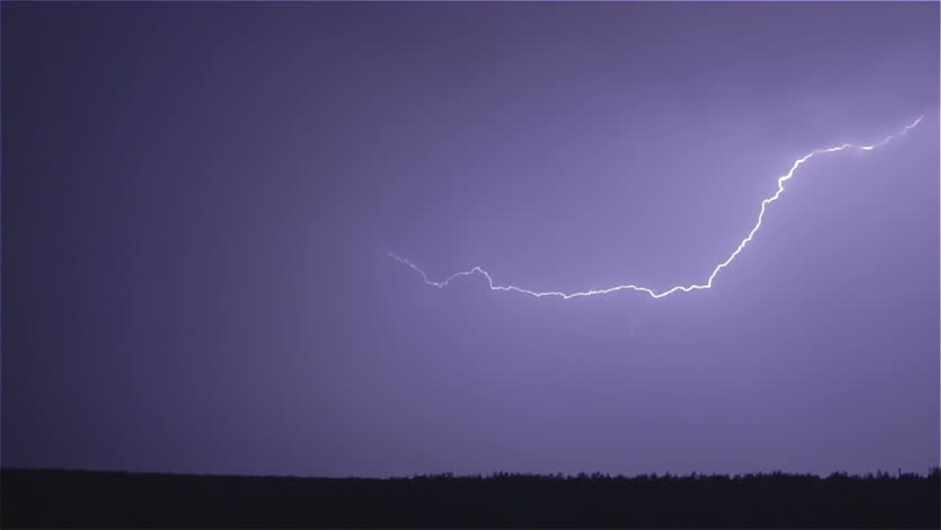 Various lightning bolts strike forest night landscape, sound included