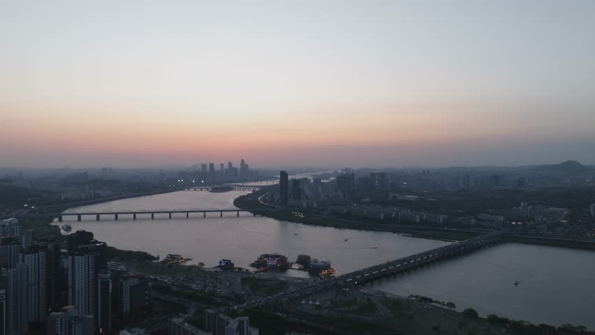 Aerial view of a stunning sunset over the Han River from Banpo, Seoul, with Some Sevit and Moonlight Rainbow Fountain, South Korea.