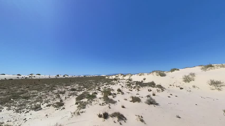 Expansive Dunes of White Sands National Park Under Clear Blue Sky With Wind-Sculpted Ripples And Wide Horizon, New Mexico, United States.
