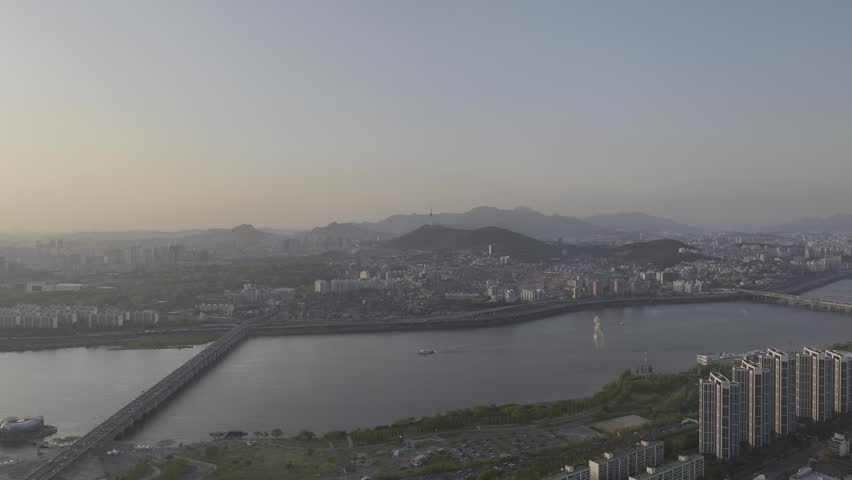 Aerial view of a stunning sunset over the Han River from Banpo, Seoul, with Some Sevit and Moonlight Rainbow Fountain, South Korea.