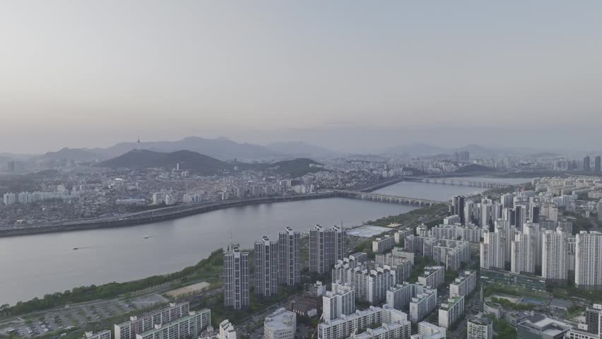 Aerial view of a stunning sunset over the Han River from Banpo, Seoul, with Some Sevit and Moonlight Rainbow Fountain, South Korea.