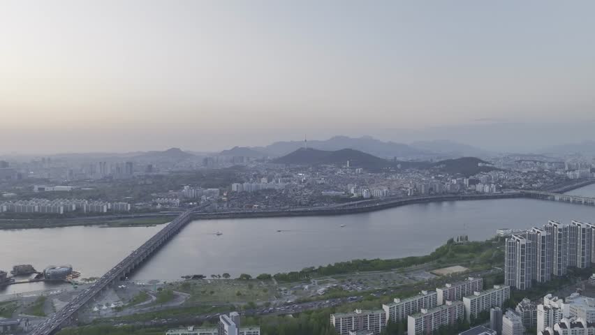 Aerial view of a stunning sunset over the Han River from Banpo, Seoul, with Some Sevit and Moonlight Rainbow Fountain, South Korea.
