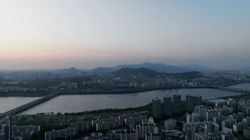 Aerial view of a stunning sunset over the Han River from Banpo, Seoul, with Some Sevit and Moonlight Rainbow Fountain, South Korea.