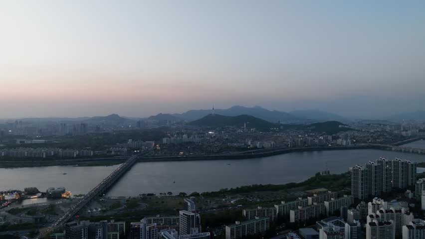 Aerial view of a stunning sunset over the Han River from Banpo, Seoul, with Some Sevit and Moonlight Rainbow Fountain, South Korea.