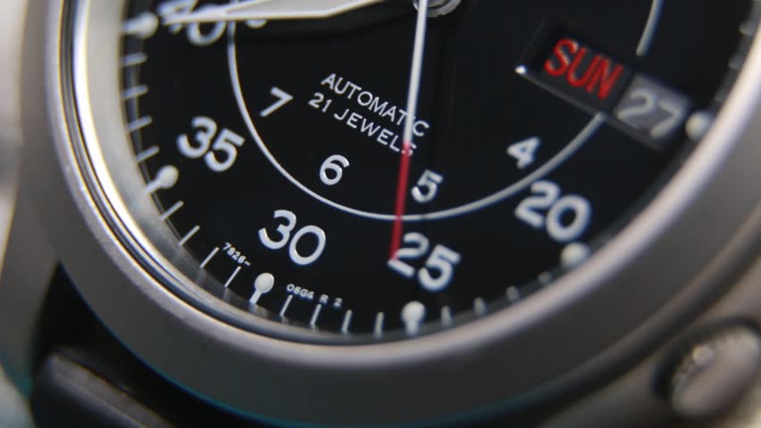 Close up of a fully automatic military watch with ticking hands
