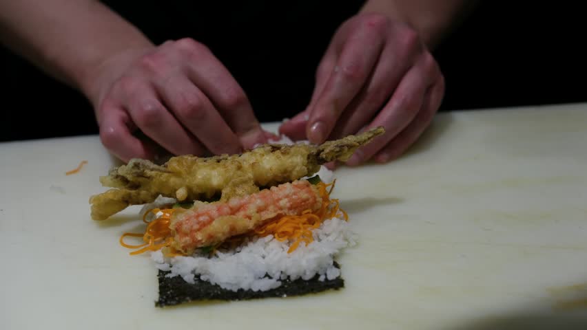 Extreme close up of a professional sushi chef