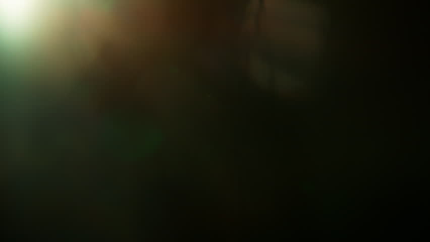 Real Cinematic Lens Flare Overlay on Black Background at 1000fps Slow Motion.