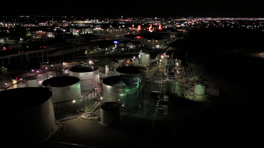 Industrial area night aerial 180 view with highway and storage tanks El Paso Texas USA April 12 2026