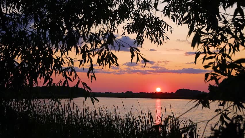 Beautiful sunset on the lake in Ukraine during summer