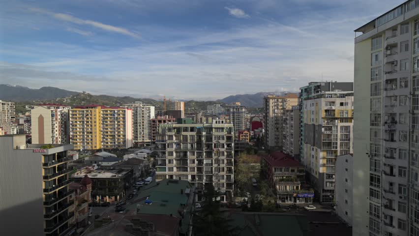 Cityscape with modern buildings and mountains