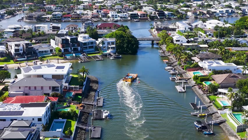 Gold Coast aerial panorama with canals, houses, and city skyline.