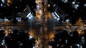 Detailed aerial footage of traffic flow at a bright city crossroads during nighttime - Powered by Shutterstock - Get 15% off with code: PIKWIZARD15