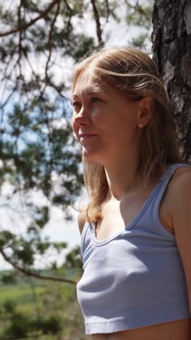 Golden sunlight bathes a blonde woman